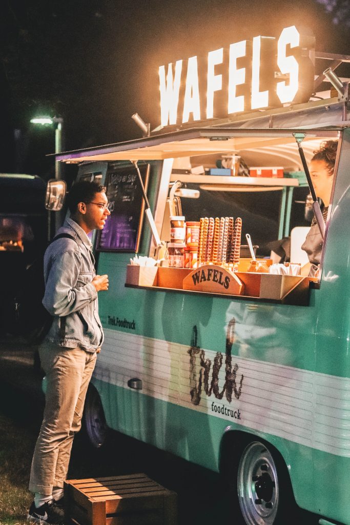 Man in front of a food truck
